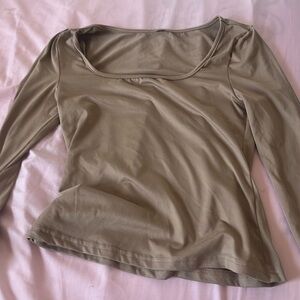A tan shirt size M